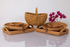 Set of woven baskets on a reflective surface with a white background